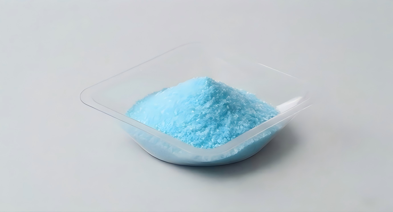 Copper gluconate blue crystalline powder in weighing boat