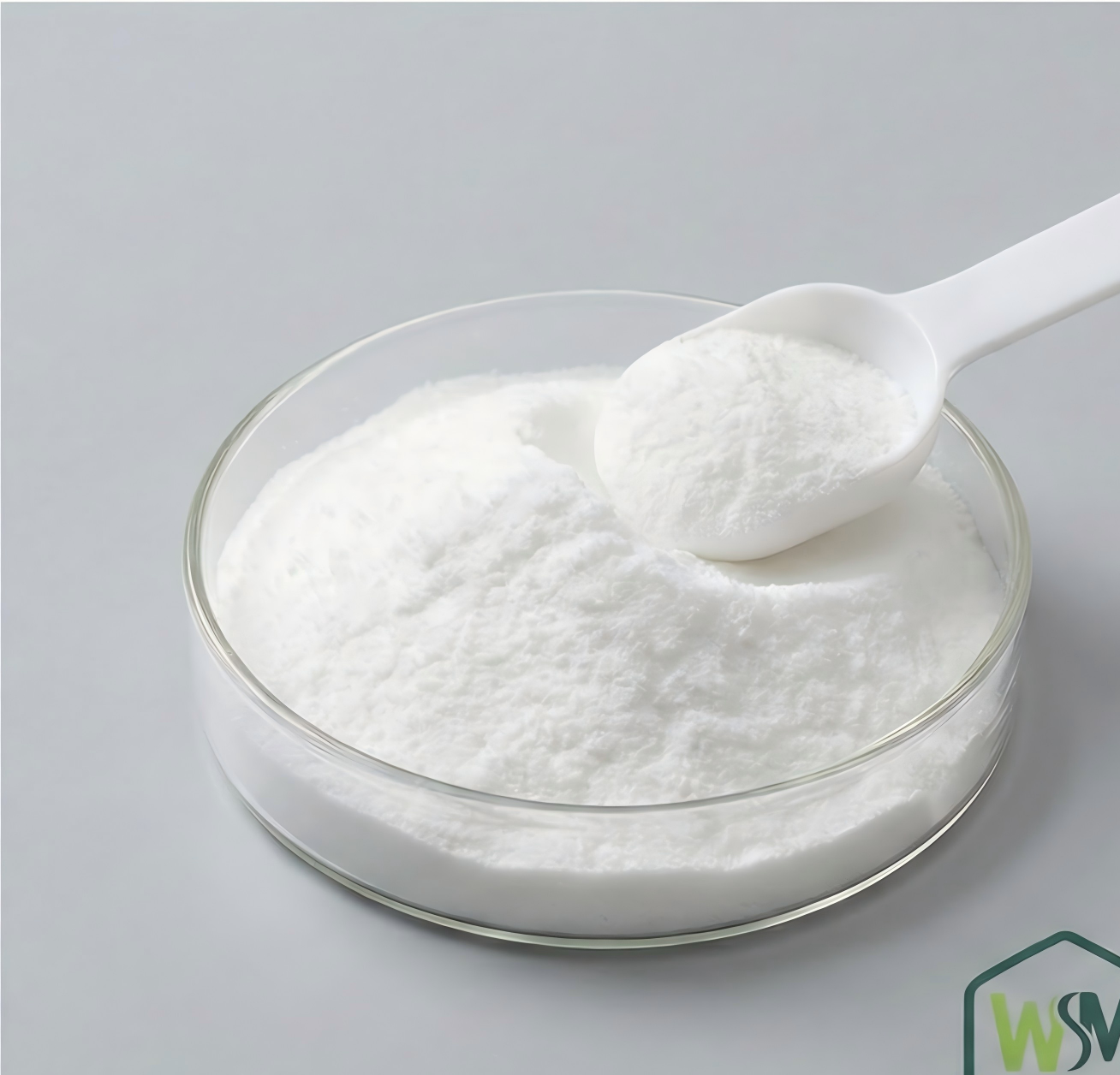 Food grade gluconate powder in petri dish with scoop